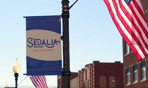 A Sedalia banner on a light pole downtown